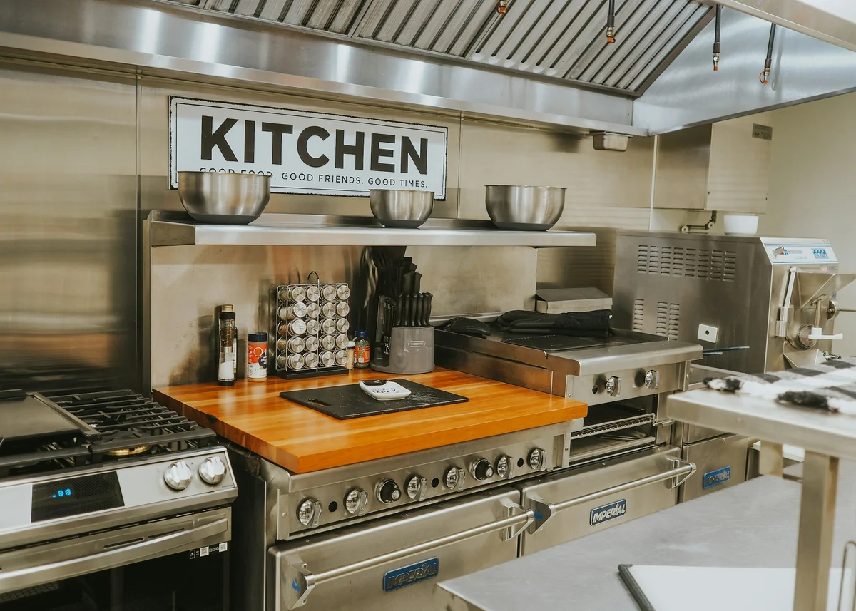 Professional commercial kitchen with stainless steel catering equipment